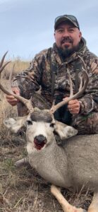 Jaime Flores and a hunted deer.